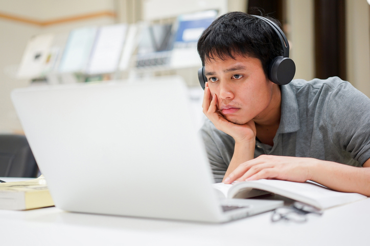 young boy using computer.