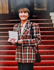 Victim Support volunteer Vera holding a medal