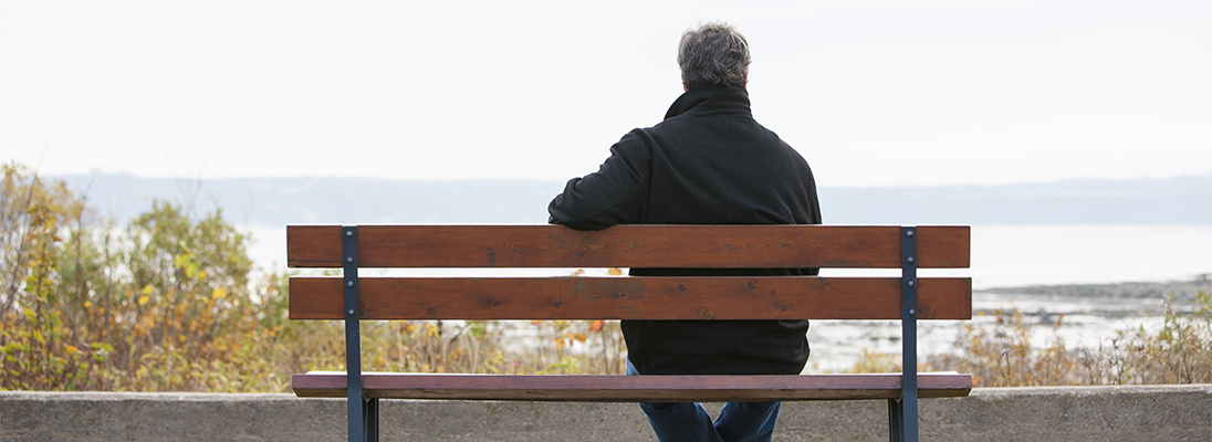 Older man sitting on bench