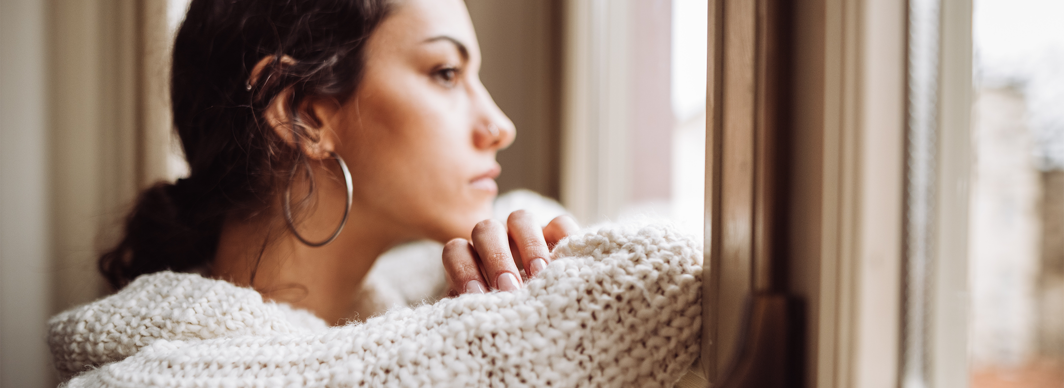 Woman looking out of window Woman looking out of window